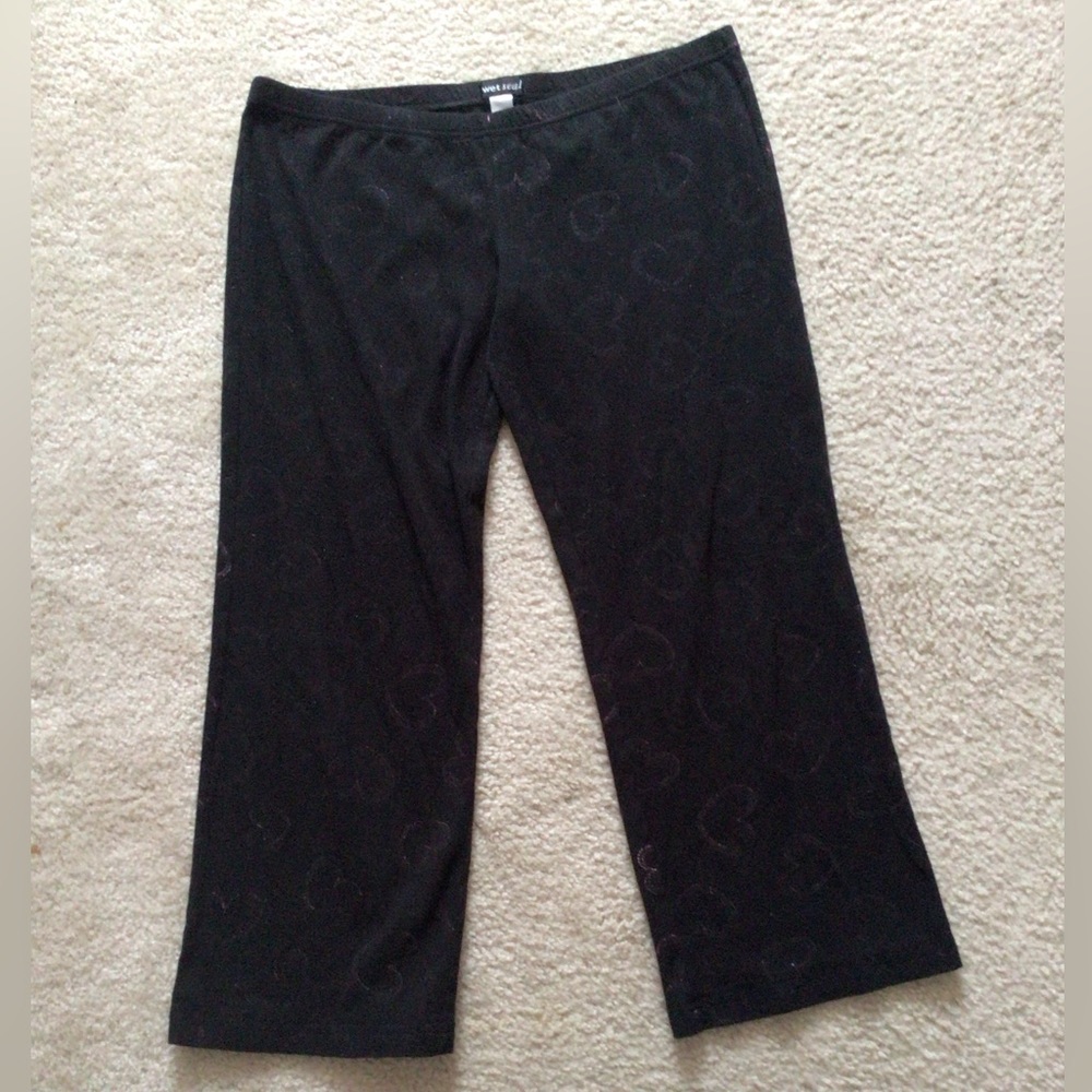 Black pajama pants with pink hearts from Wet Seal. Says medium but they’re large